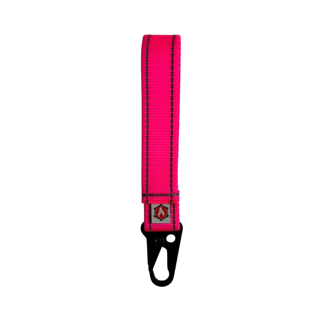 A durable Pink Grab & Go Loop by Recycled Firefighter features a rugged nylon construction and loop-side Velcro for modular portability.