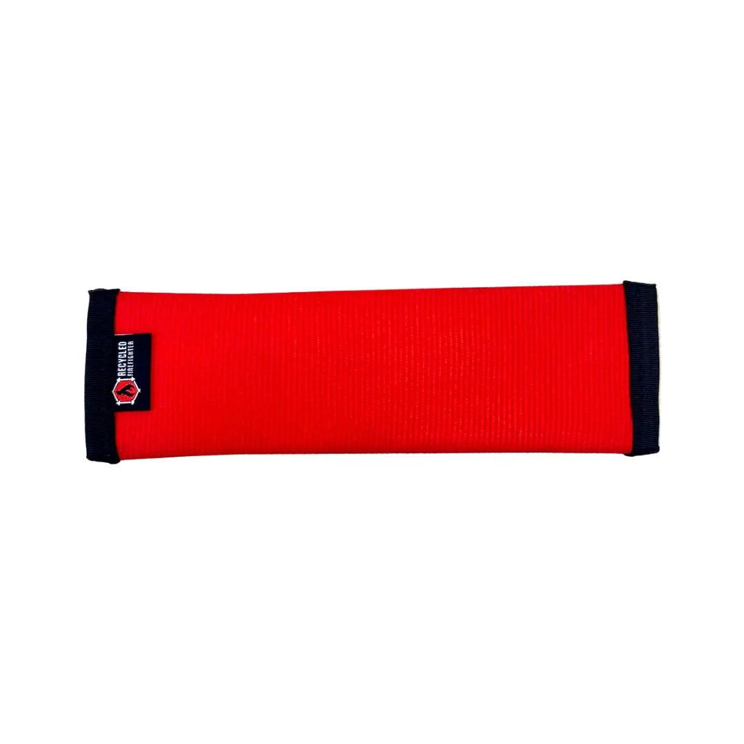 A red and black small-sized dog fetch toy by Recycled Firefighter, handcrafted from decommissioned fire hose material for high-strength tug and fetch play.