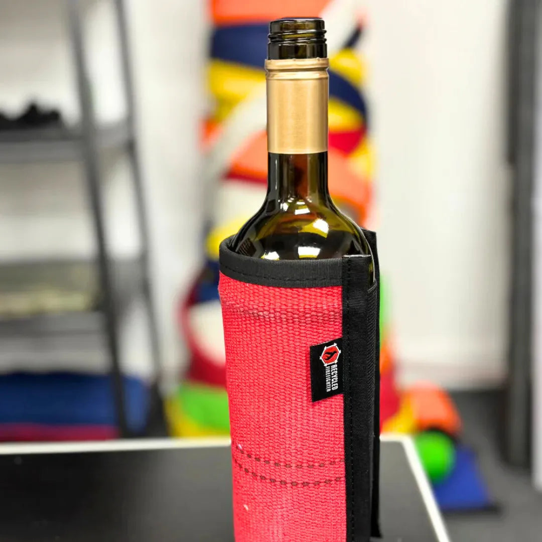 Red Firehose Wine Bottle Cover from Recycled Firefighter. Professional tactical construction for everyday operations.