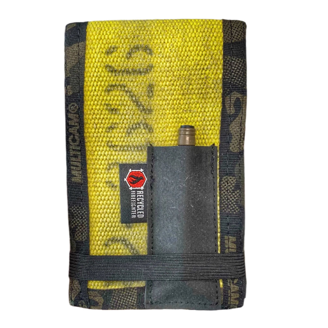 The Rite In The Rain Notebook Cover in Vintage Yellow and Multicamblack by Recycled Firefighter. Tactical design meets professional durability standards.