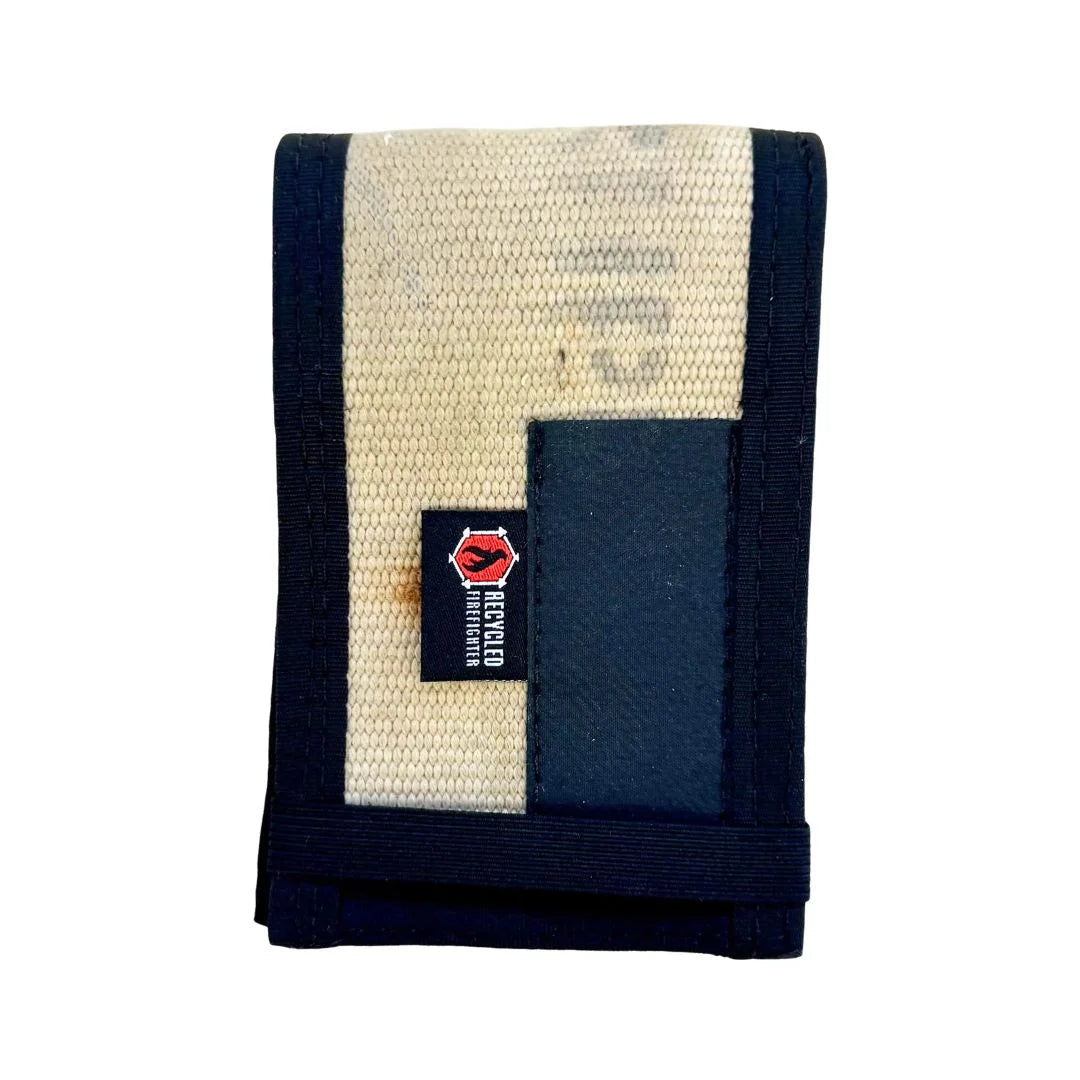 The Recycled Firefighter 'First Responder' Rite in the Rain Notebook Cover in Olive Drab and Black. This rugged cover is handcrafted from repurposed olive drab fire hose with black mil-spec nylon binding and features a black leather pen slot on the front with a secure black elastic closure.