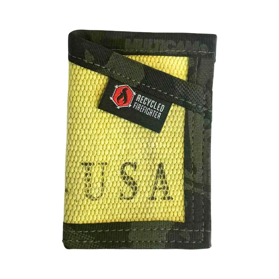 A weathered Vintage Yellow Sergeant Wallet Firehose Edition by Recycled Firefighter featuring a Multicam Black elastic strap.