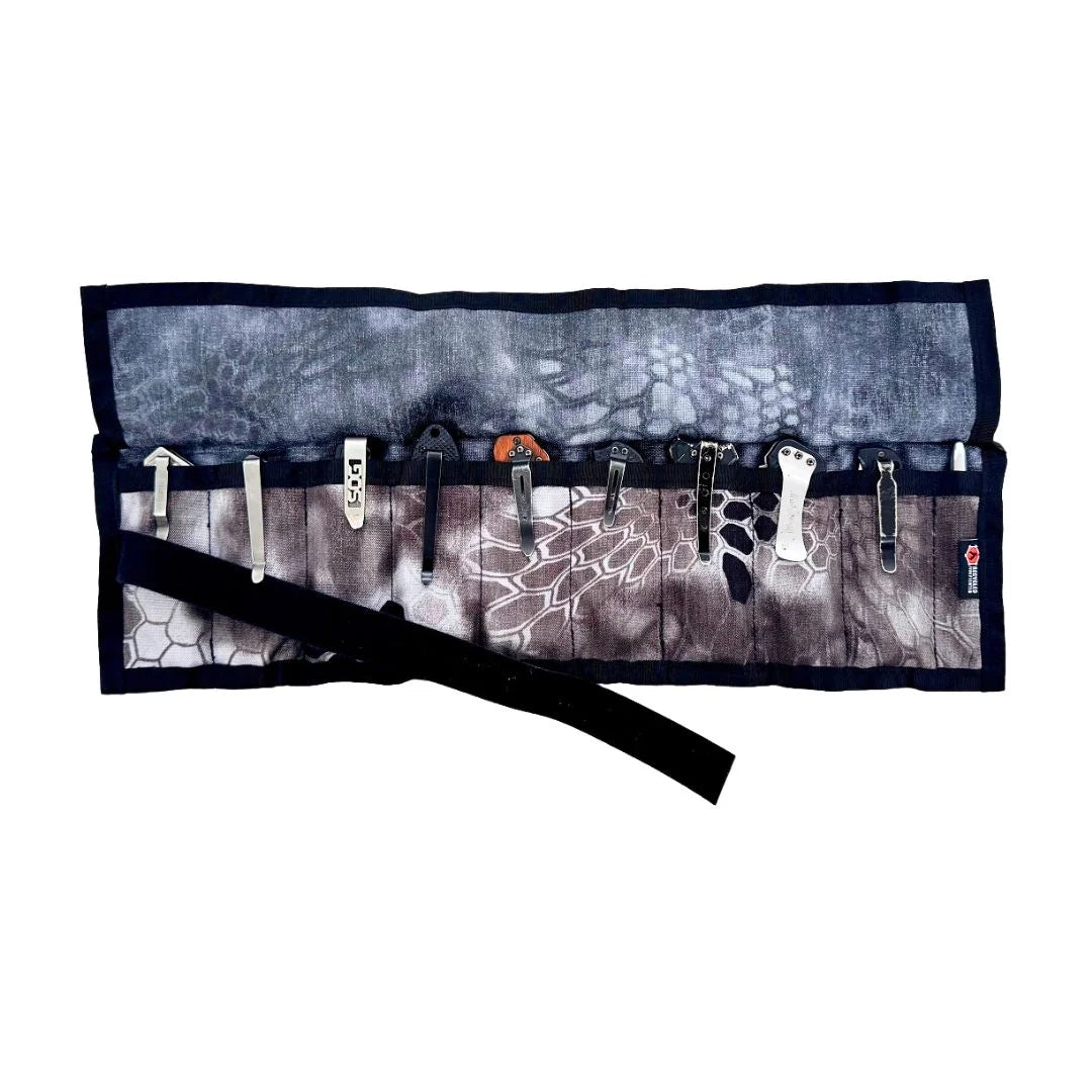 Interior view of the Recycled Firefighter Small Tool Roll showing 8 two-inch slots and 2 one-and-a-half-inch slots for organizing EDC gear, pocket knives, and small tools.