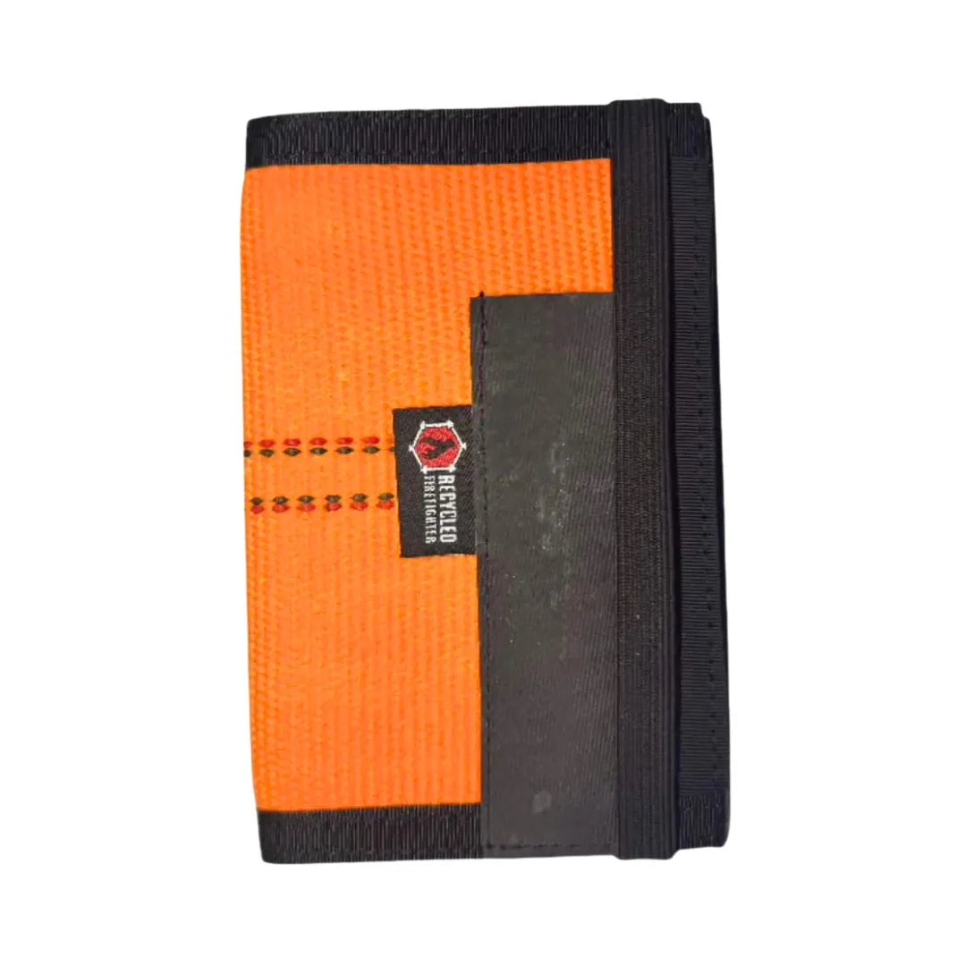 The The Inspector Notebook in Orange and Black by Recycled Firefighter. Tactical design meets professional durability standards.