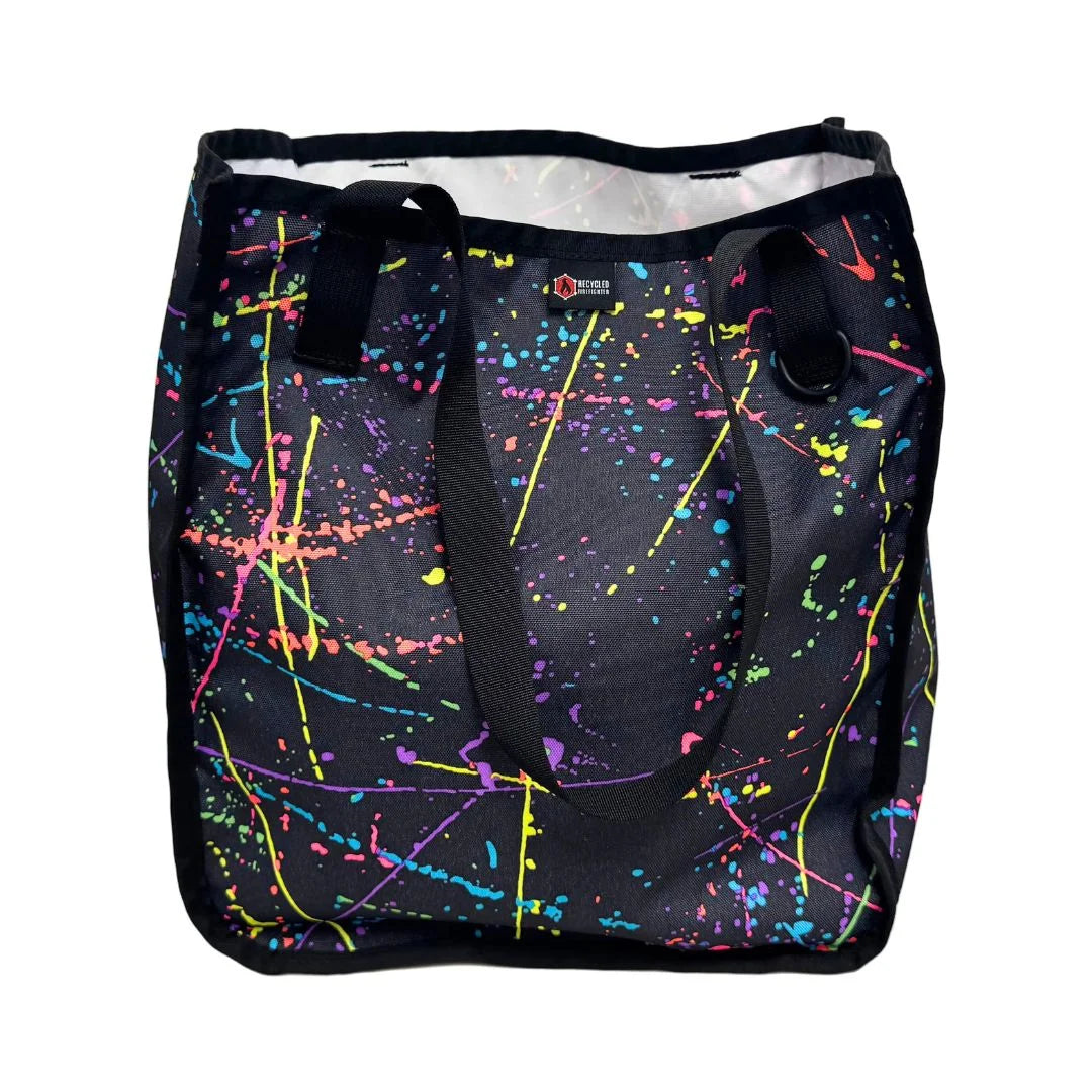 Professional The Tactical Tote Bag in splatter by Recycled Firefighter. Tactical design honors first responder service with quality materials.