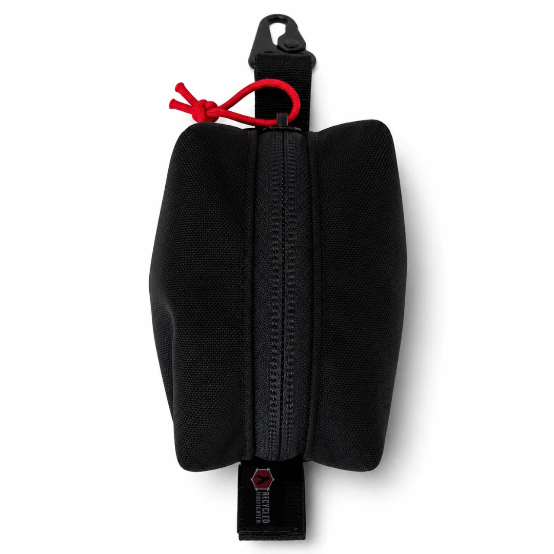 Recycled Firefighter's Hot Shot Commander Keychain Pouch in Black with Red Pull features a striking contrast of a matte black exterior and a vivid red zipper pull. This USA-made keychain EDC pouch clips securely to any carry point for quick-access organization.