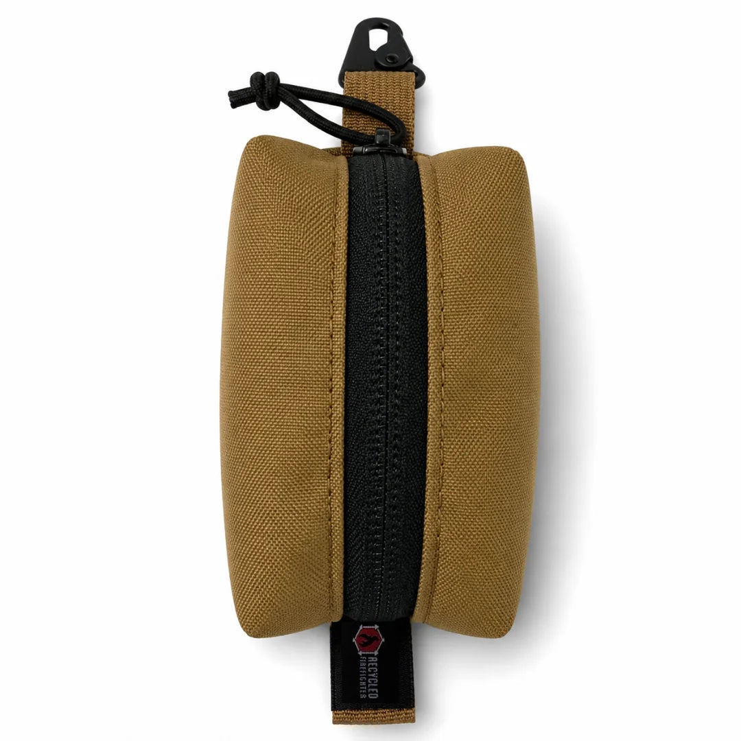 Recycled Firefighter's Hot Shot Commander Keychain Pouch in Coyote tan offers a classic desert-toned EDC clip pouch with lasting durability for everyday use. The high-strength metal clip and zippered enclosure make it a dependable keychain organizer built and assembled in the USA.