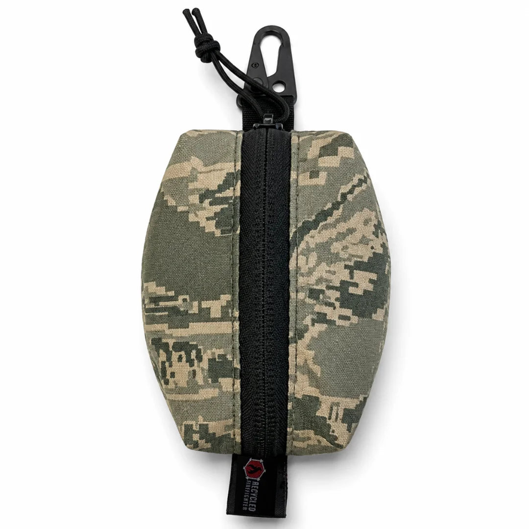 The Tigerstripe Hot Shot Commander Keychain Pouch from Recycled Firefighter brings a Vietnam-era inspired pattern to a rugged, USA-made EDC keychain organizer built for demanding daily carry. Its heavy-duty zip and high-strength metal clip make it a standout tactical carry solution.