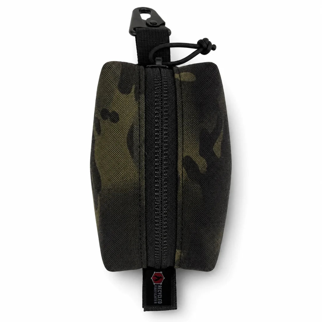 The Mcam black Hot Shot Commander Keychain Pouch by Recycled Firefighter is a sleek, battle-tested EDC essential engineered for durability and daily use. The zippered pouch clips instantly to keys, belt loops, or pack webbing for secure, low-profile carry.