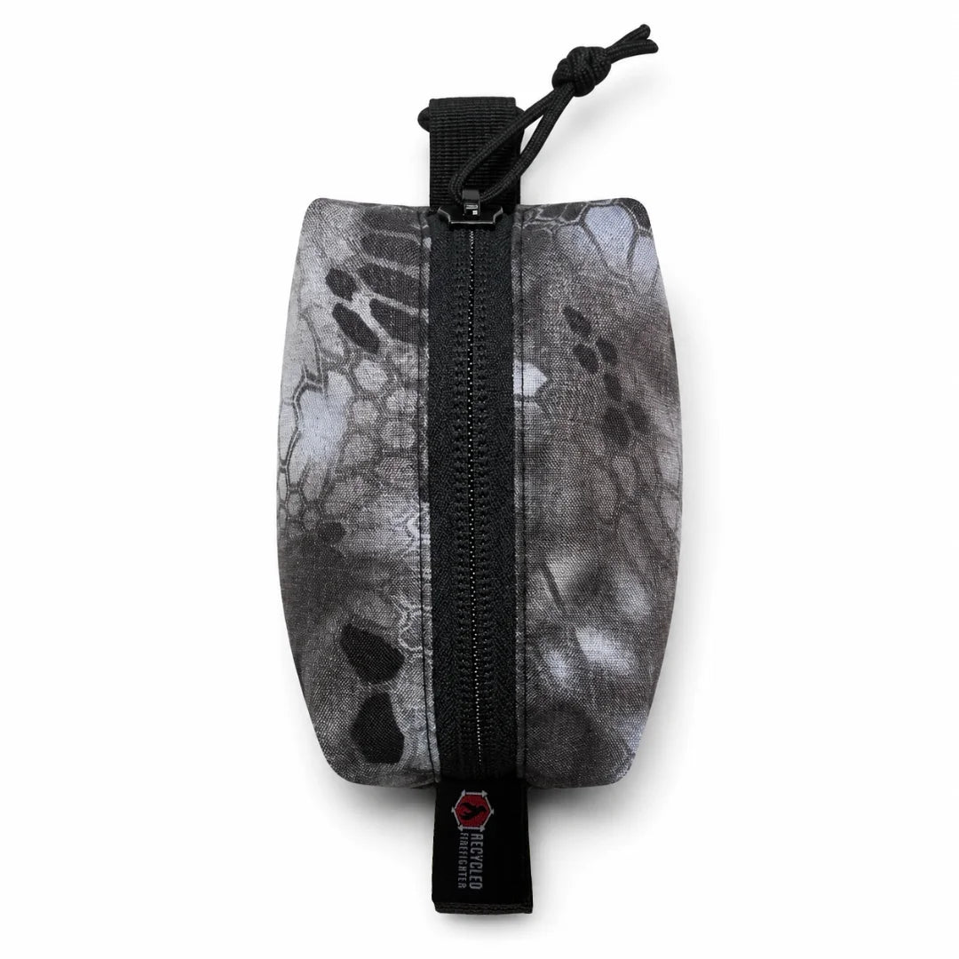 Recycled Firefighter's Hot Shot Commander Keychain Pouch in Raid, a tactical-patterned EDC clip pouch built for rugged everyday carry. Compact and USA-made, this keychain organizer features a heavy-duty zipper and high-strength metal clip for belt loop or backpack attachment.