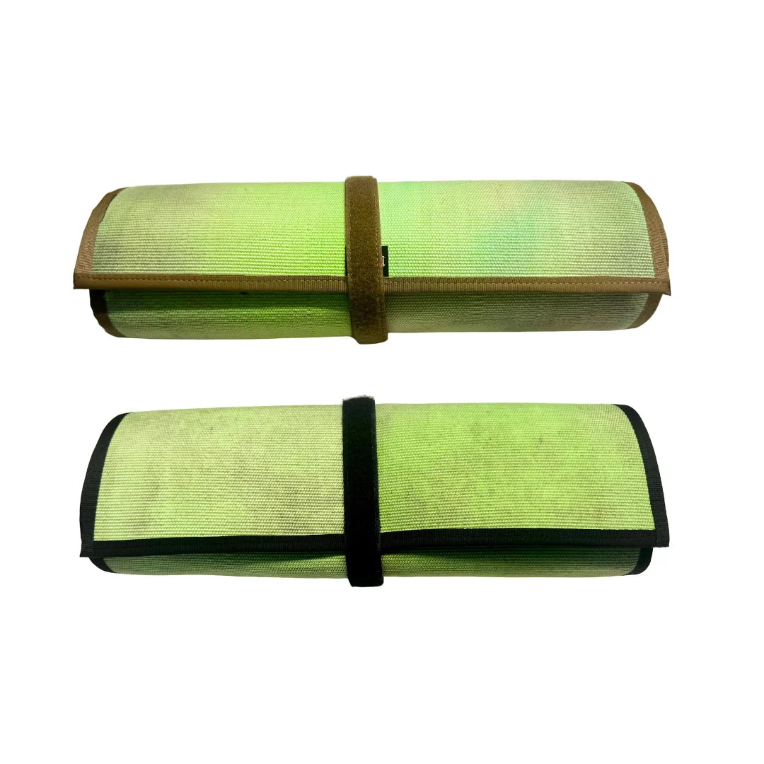 Recycled Firefighter Long Rifle Mat Firehose Edition showing both Vintage Green & Woodland and Vintage Green & Multicam variants rolled side by side. USA-made from authentic fire hose with hook-and-loop roll-up straps for easy range carry.