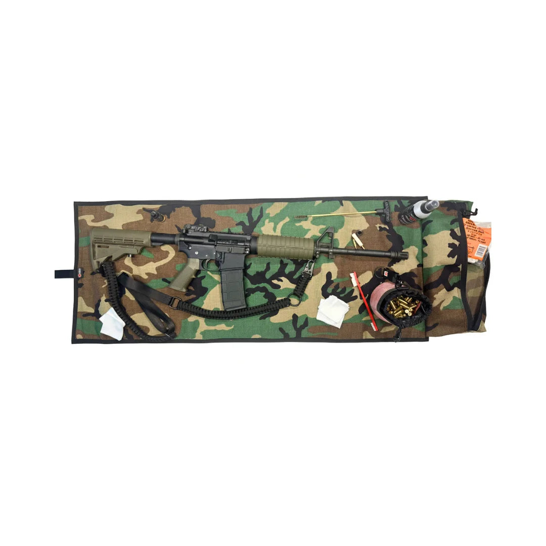 Recycled Firefighter Long Rifle Mat Firehose Edition in Vintage Green & Woodland displayed with a rifle and Ammo Gear Bag. Handmade in the USA from real fire hose for shooters who demand durable American-made range gear.
