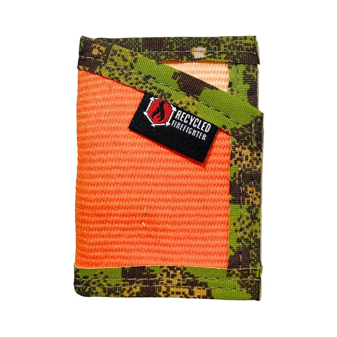 The Sergeant minimalist wallet by Recycled Firefighter, crafted from repurposed orange fire hose with green digital camo nylon binding and an elastic money clip strap.