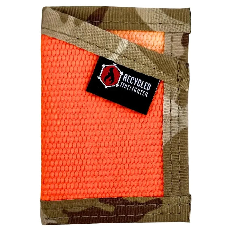 A Recycled Firefighter 'The Sergeant' slim front-pocket wallet made from decommissioned orange fire hose with a Multicam Arid desert camouflage elastic cash strap and black nylon edging.