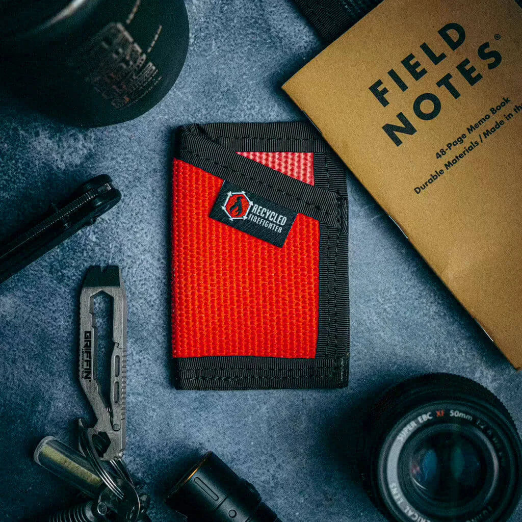 Fire hose wallet detail showing Mil-Spec nylon edge binding and T-70 thread stitching