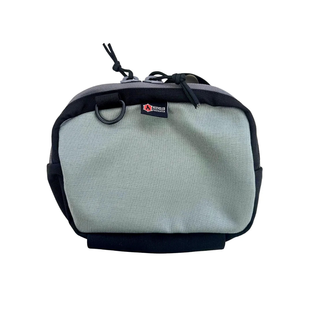 Neutral grey TrailHound Fanny Pack from Recycled Firefighter. Versatile color blends into urban and outdoor environments seamlessly.