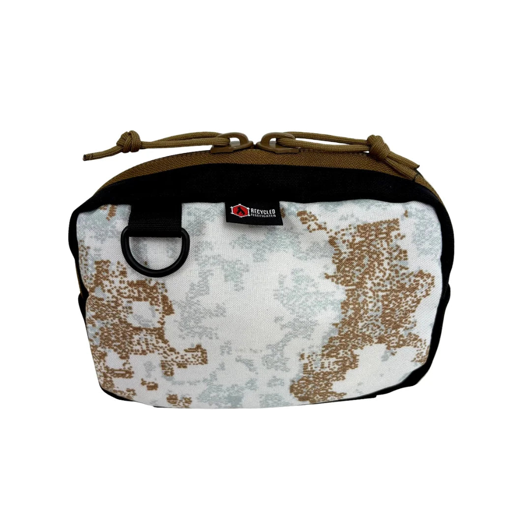 Winter snowdrift TrailHound Fanny Pack from Recycled Firefighter. Light-colored camo adapts to snow-covered environments.