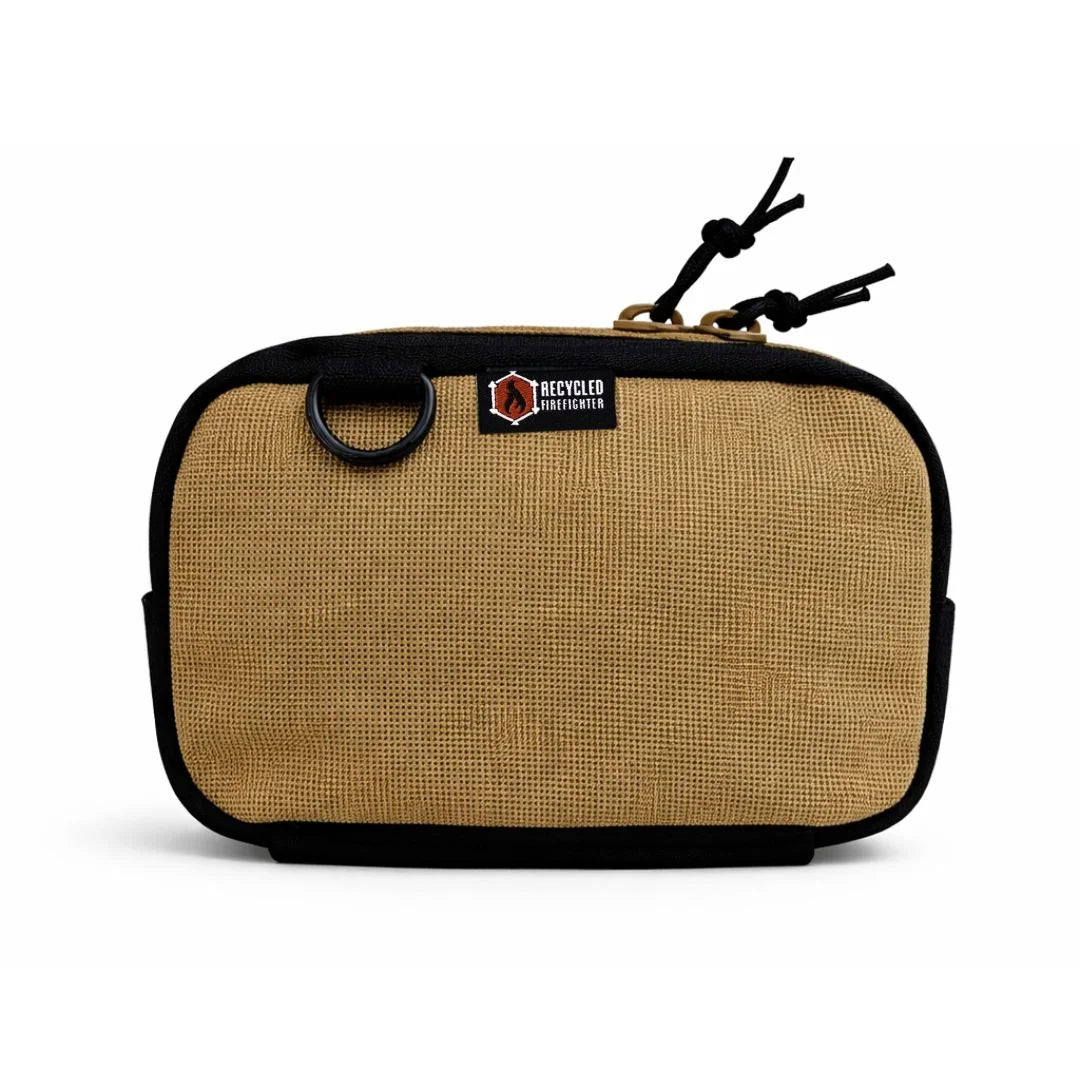 A minimalist tan bunker gear fanny pack from Recycled Firefighter made from authentic MSA-brand turnout gear. This variant features a clean, rugged brown canvas look without the reflective safety stripes, showcasing the raw material's durability.