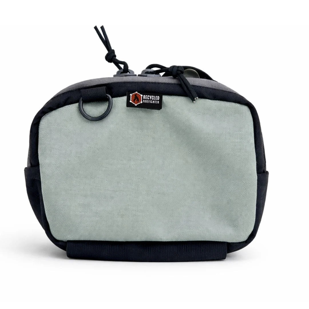 Neutral grey TrailHound Fanny Pack from Recycled Firefighter. Versatile color blends into urban and outdoor environments seamlessly.