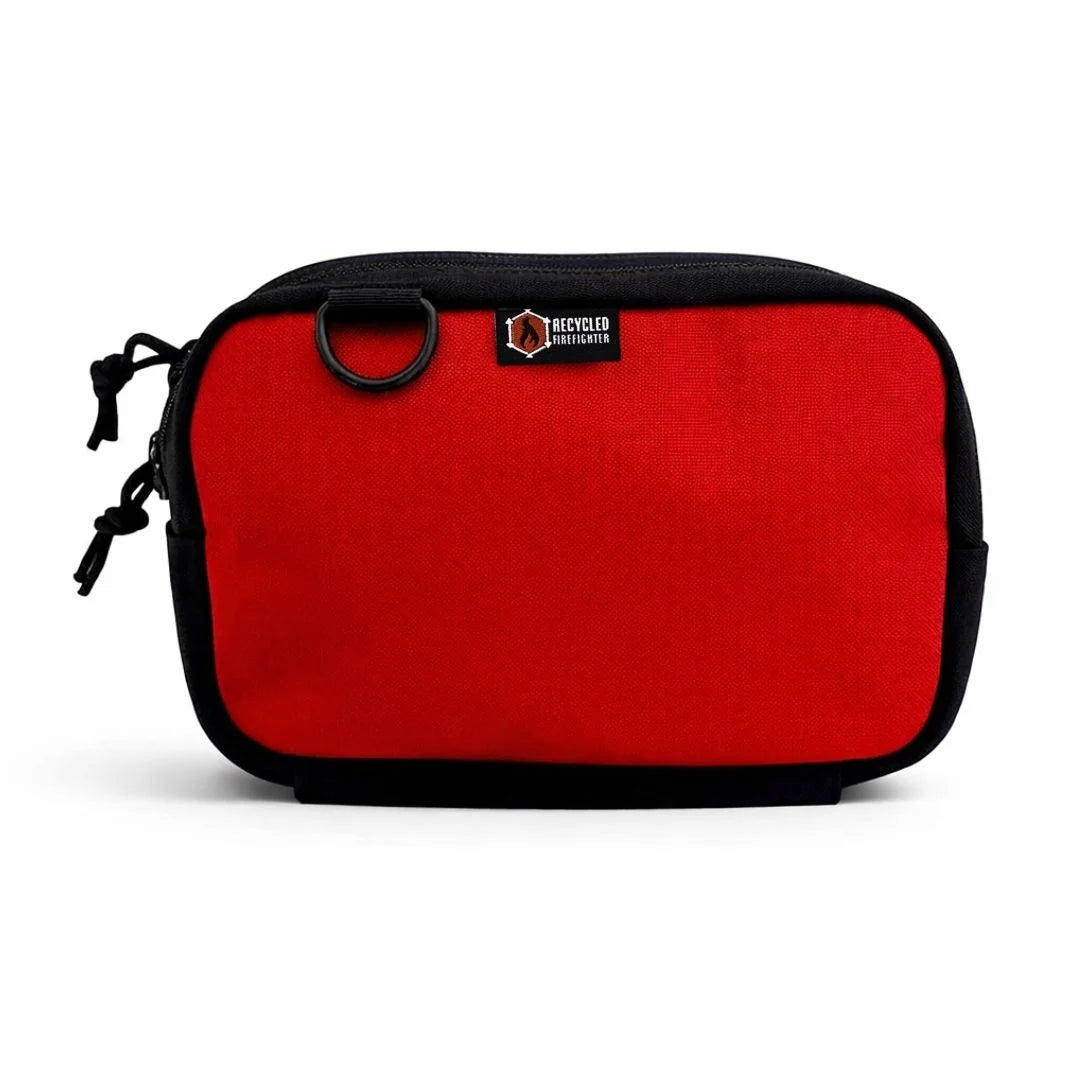 High-visibility red TrailHound Fanny Pack by Recycled Firefighter. Bold color ensures gear identification during emergency response.