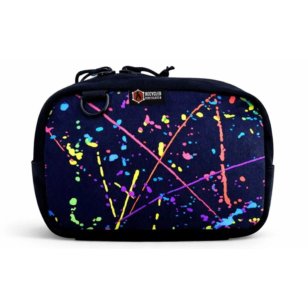 Artistic splatter pattern TrailHound Fanny Pack. Recycled Firefighter's unique 500D design combines style with tactical function.